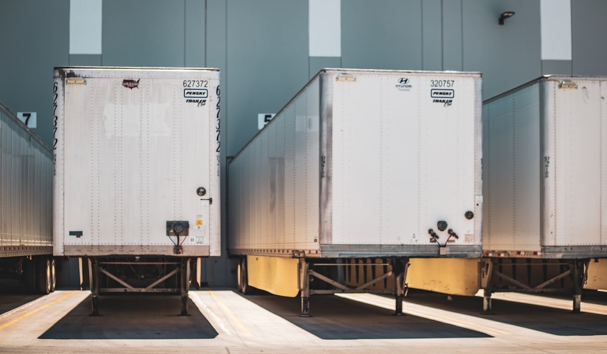 Commercial fleet trailers at a Canadian loading dock — real fleet operations